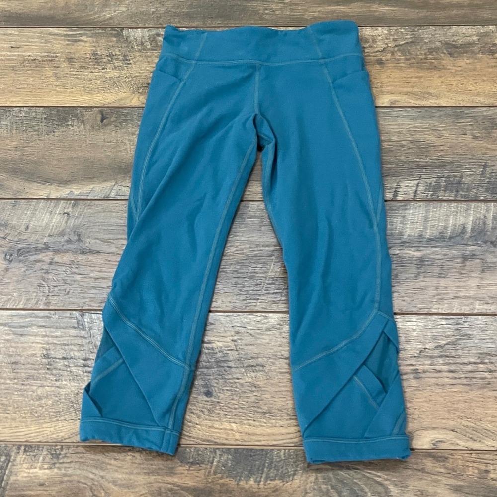 Athleta Girl Teal Blue Cropped Leggings Side Pockets Lattice Hem Size Large 12